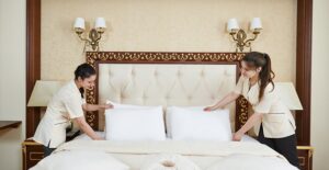 maids turn down a fancy bed in a boutique barcelona hotel