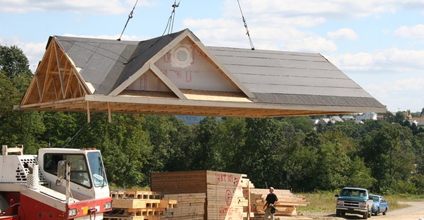 Builders putting together a modular home