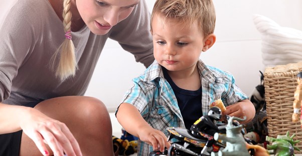 A little boy playing with his nanny.