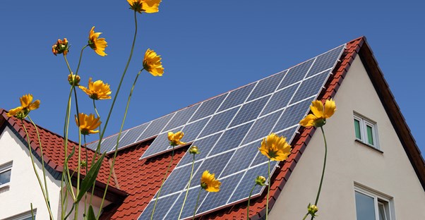 A for-sale home with solar panels.