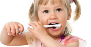 a little girl who doesn't know what causes dental caries