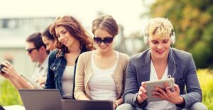 Writers type away on their laptops and tablets
