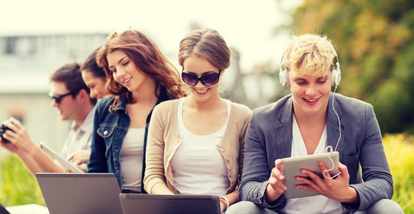 Writers type away on their laptops and tablets