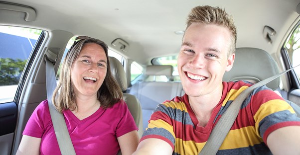 Mother and son take a selfie.