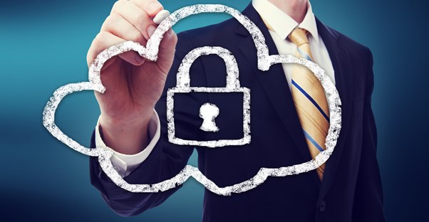 Business man drawing an image of a cloud and a deadbolt.