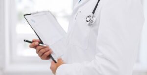 Doctor helping patients understand cost of ED treatment