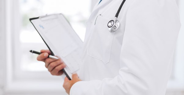Doctor helping patients understand cost of ED treatment