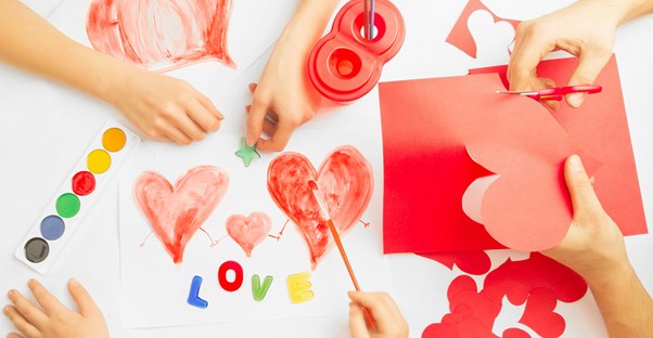 Mom and kids making Valentine cards.