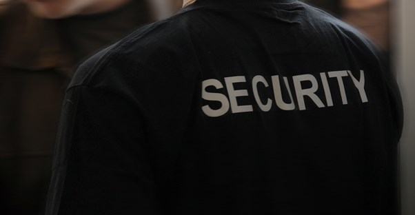 The back of a security guard tshirt.