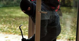 a burglar breaking into a house