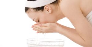 a woman using a blackhead treatment