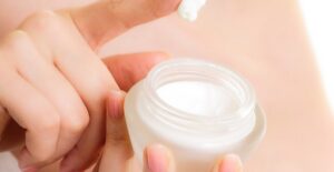 a woman holding a guttate psoriasis treatment