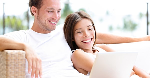 A couple researching online psychology degrees.
