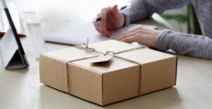A healthy subscription box sitting on a desk and waiting to be opened.