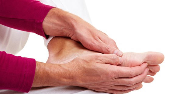 a man experiencing foot pain