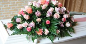 Flowers on a casket at a funeral