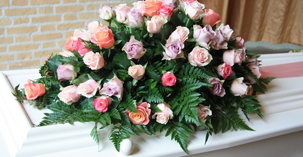 Flowers on a casket at a funeral