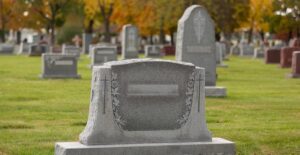 A large headstone in a cemetery