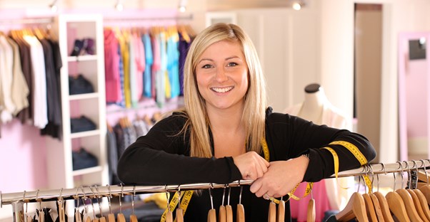 A young girl shops for work clothes
