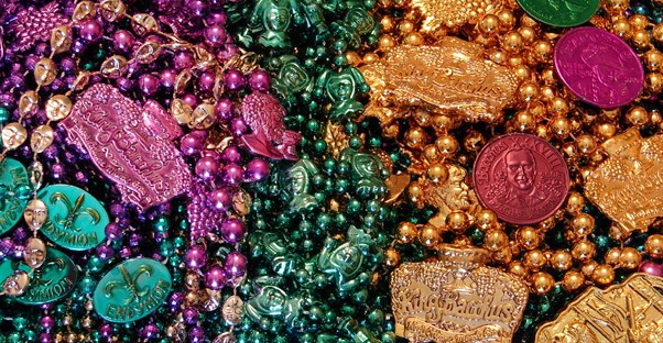 a pile of new orleans mardi gras beads