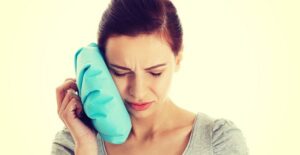 a woman recovering from wisdom teeth removal
