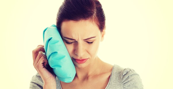 a woman recovering from wisdom teeth removal