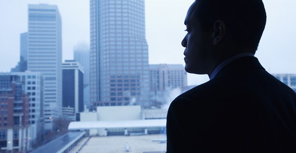 Chief Marketing Officer looking out a window, planning his next move