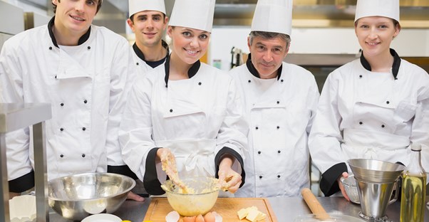 A groups of chefs make a mess in the kitchen