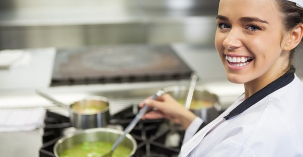 A chef cooks in a kitchen