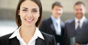An administrative professional smiling at work.