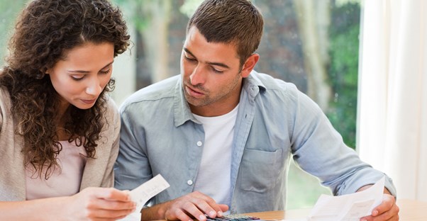 Couple discussing how they should approach their debt
