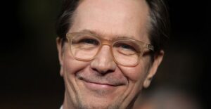 Gary Oldman smiling.