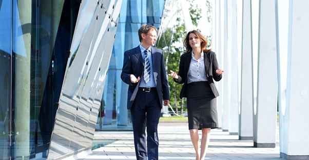Student taking a tour around the campus of a business school