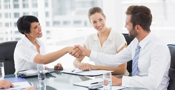 Group of people exchanging business cards