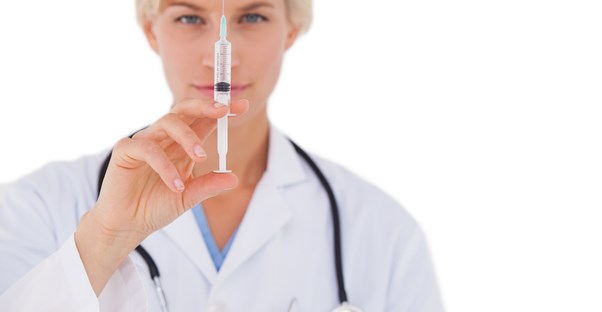 A doctor prepares an epinephrine injection