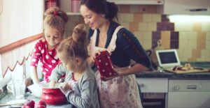 A mother and her daughters making healthy baked goods