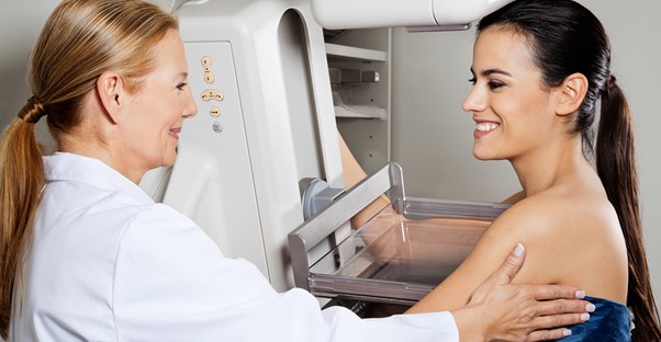 a woman undergoing a breast exam