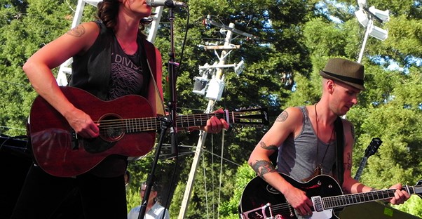 a band rocks out at a popular summer music festival