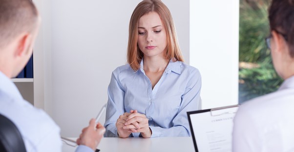 A young woman freezes up during a job interview