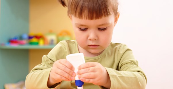 A young child works on a craft project for school