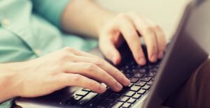 An aspiring ESL teacher works online to obtain their ESL certification online