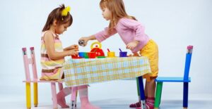Two sisters having a tea party