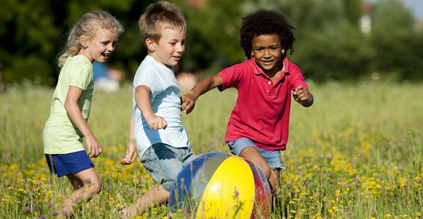 A brother and sister playing with a friend