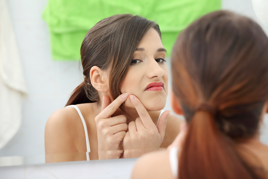 3. Popping pimples.