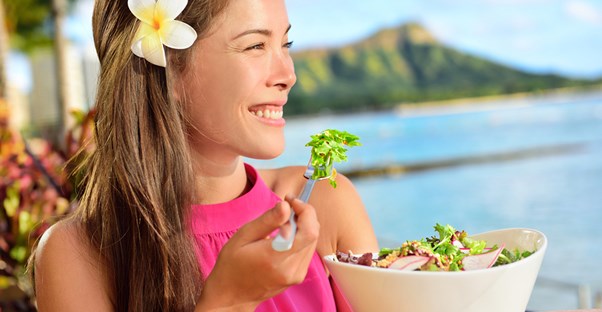 Woman enjoying a salad in Hawaii