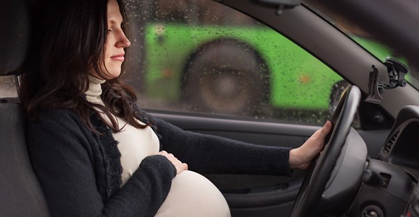 Pregnant woman preparing for a long ride