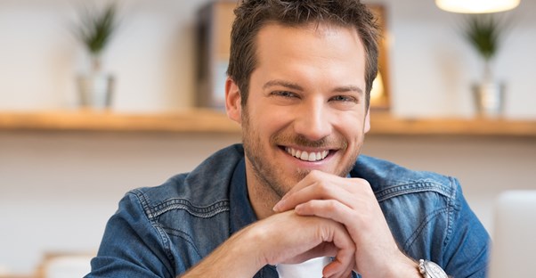 Man smiles creepily