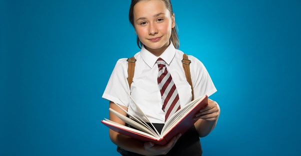 A young student prepares for boarding school