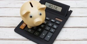 Piggy bank on a calculator that says 401k