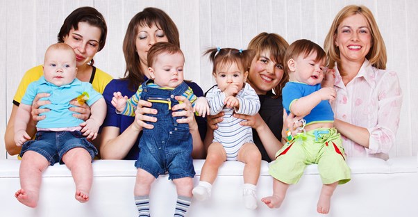 A group of moms with their babies.